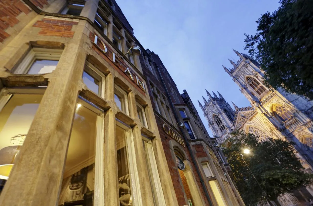 a building with a clock tower and a building with a clock tower at The Dean Court in York